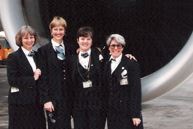 1991, October, From left to right crew members  Judy Donaghy Judy Skartvedt, Jan Pope, Nancy Hite Speck pose in front of the engine of a Pan Am Airbus A310 at the Airport in Rome, Italy.